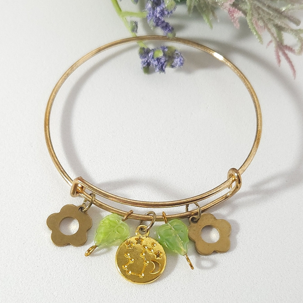 Gemini Zodiac Sign & Glass Green Leaf Charm Bracelet Gold Tone